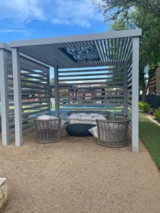 Open-air cabana blends modern design with cozy seating for outdoor relaxation