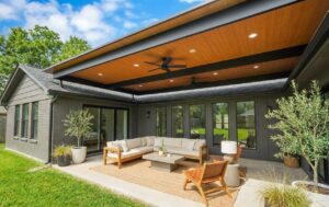 Attached pergola creating walkout patio. 